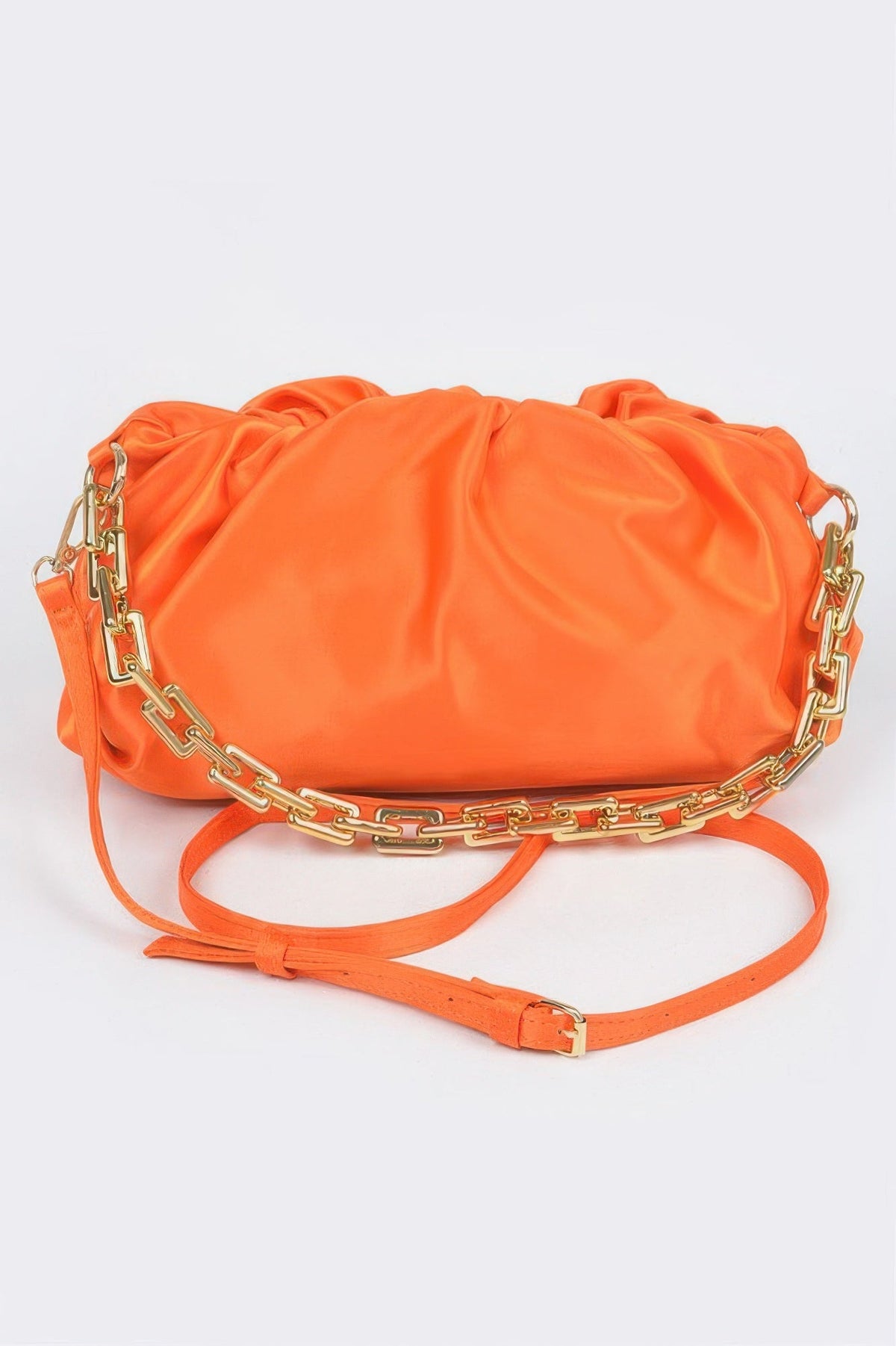 Orange women's handbag with gathered fabric and gold chain strap