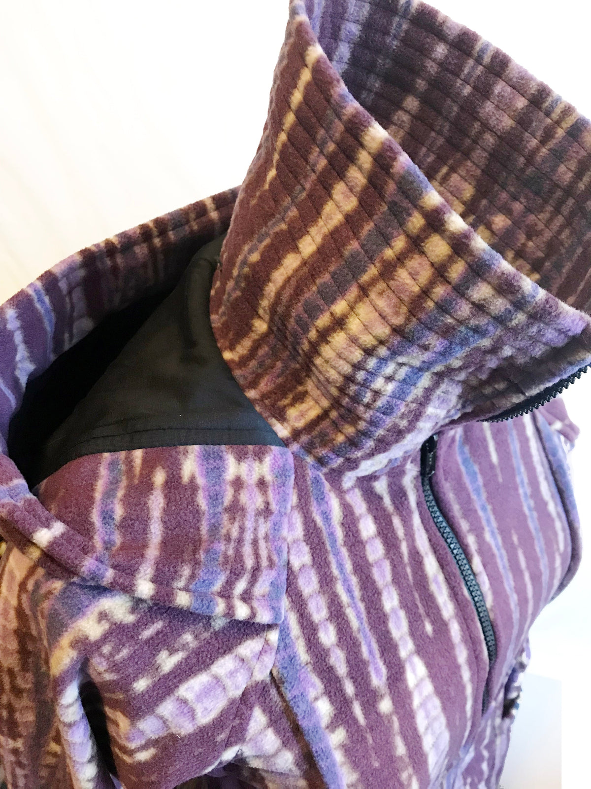 Multicolor striped fleece hood and zip-front placket with cozy, lined hood