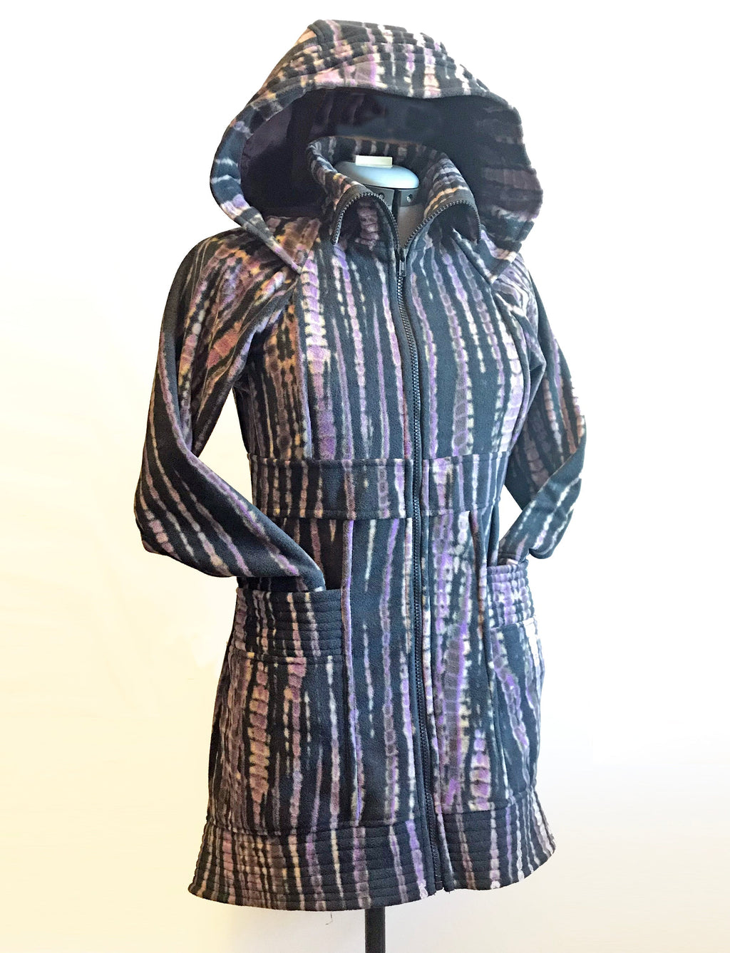 Fleece hooded sweater jacket, dark multi-color striped pattern, mannequin side front