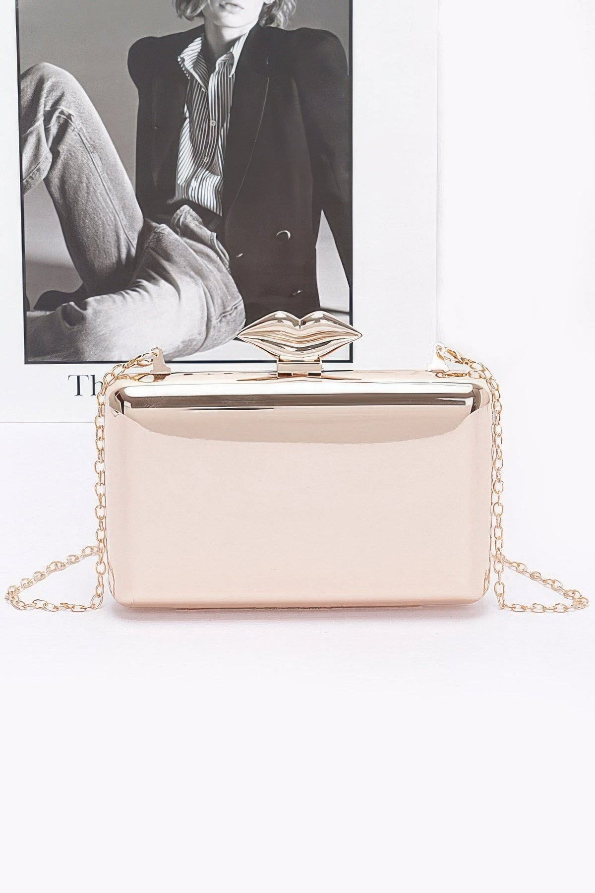 Light beige women's clutch with gold-tone chain and hinged top frame