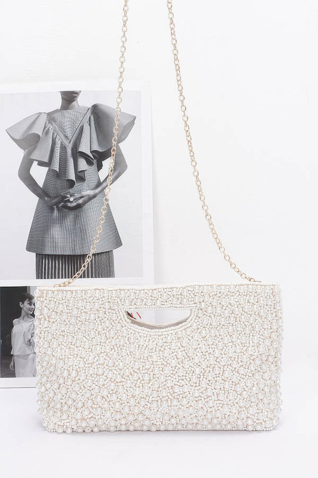 Cream beaded clutch bag with gold-tone chain strap