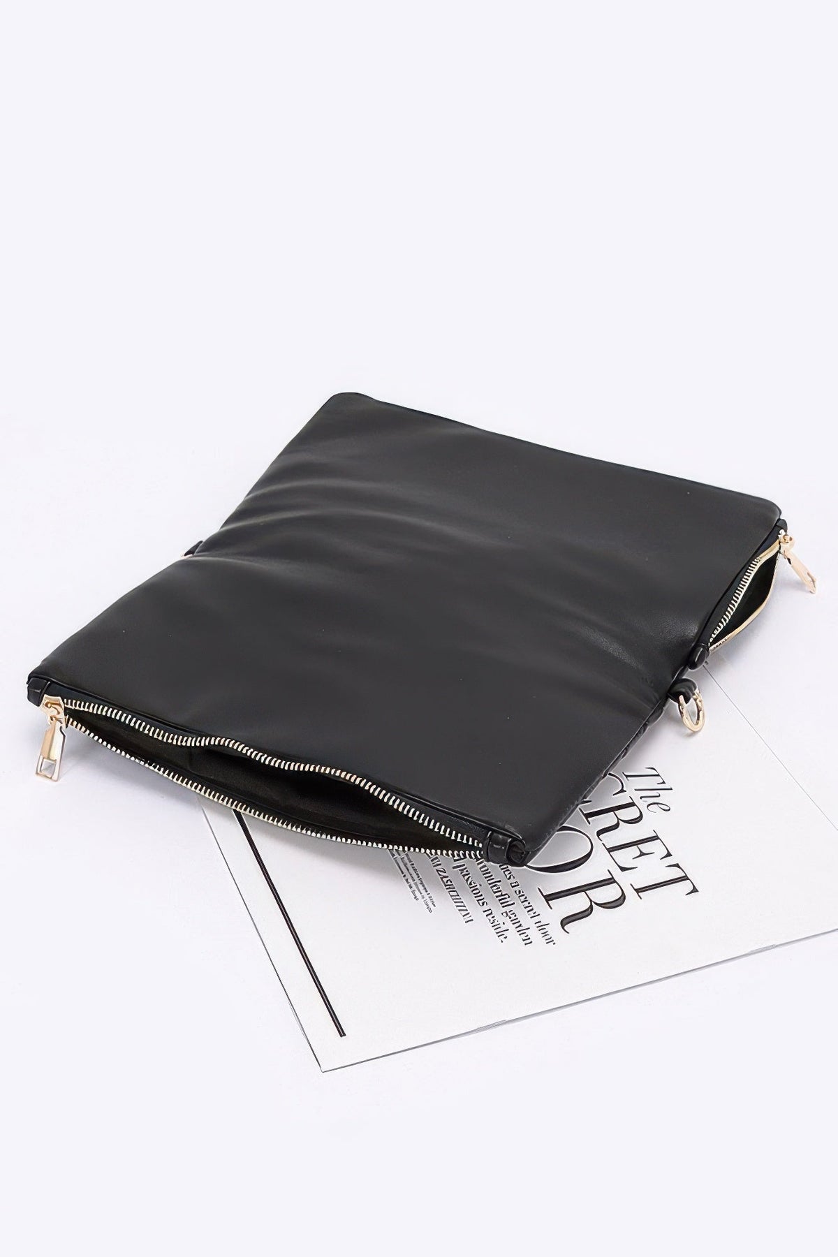 Black leather-look zip clutch with smooth back panel and gold-tone zipper pull