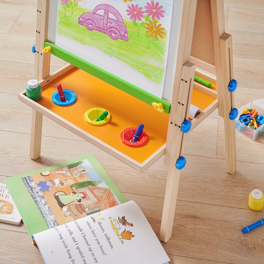 Kids art easel lower tray with paint cups and markers, green board, wooden frame