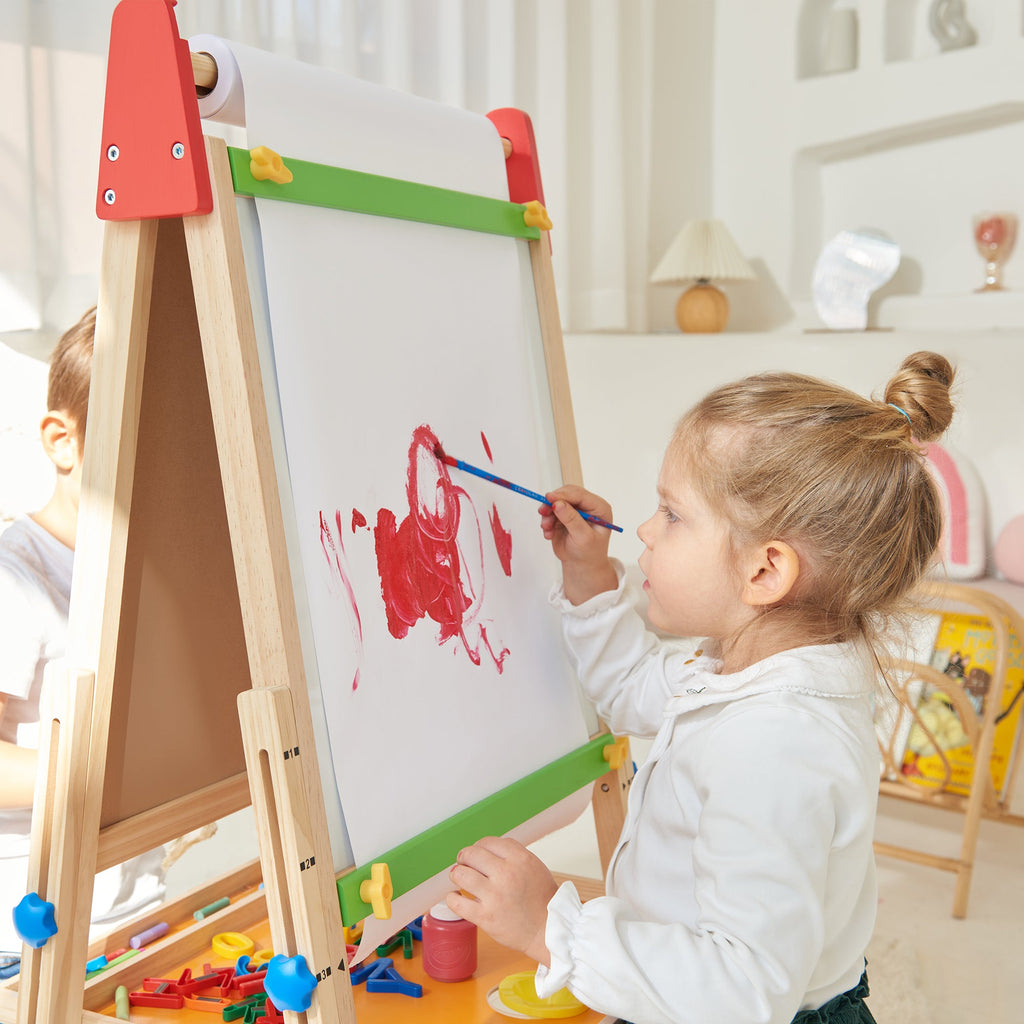 Wooden kids art easel with white paper sheet and green roller bar