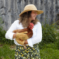Raffia sun hat with wide brim, natural straw tone, and navy inner band