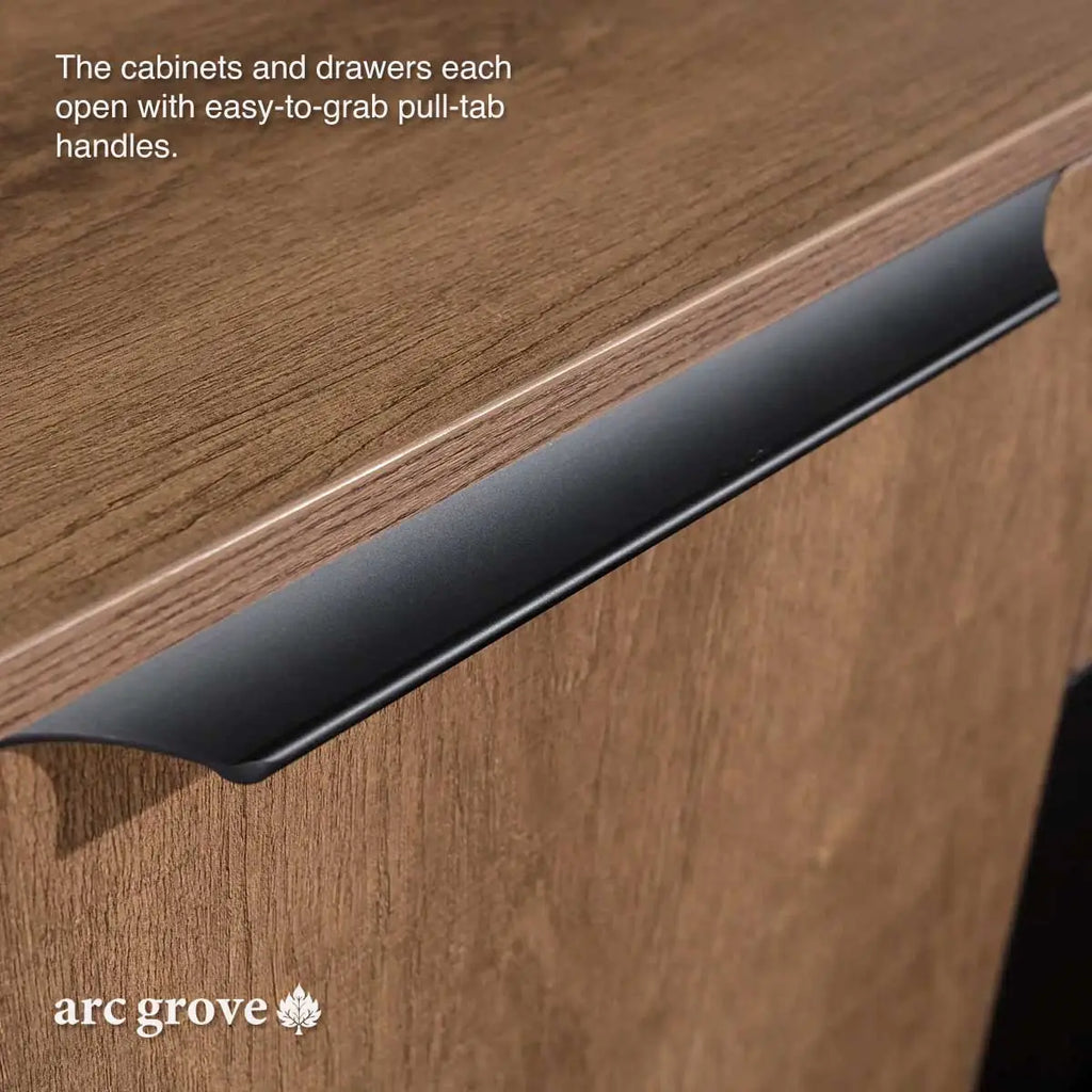 Brown oak desk edge with black pull-tab handle on the cabinet face