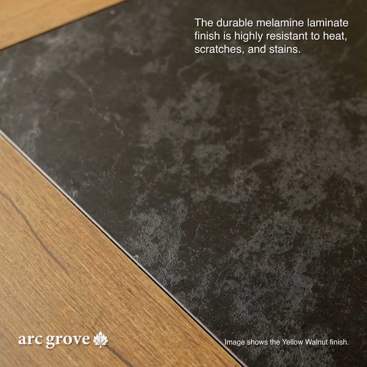 Laminate desk corner surface in a dark, speckled finish with angled edge