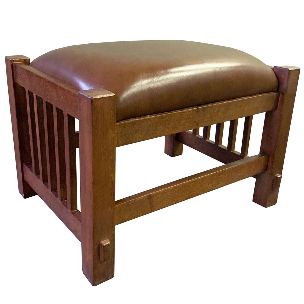 Brown leather-look arm chair with slatted sides and front foot supports detail