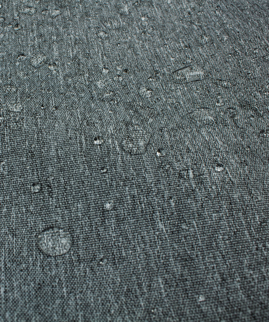Water-resistant-looking gray cover fabric surface with speckled texture