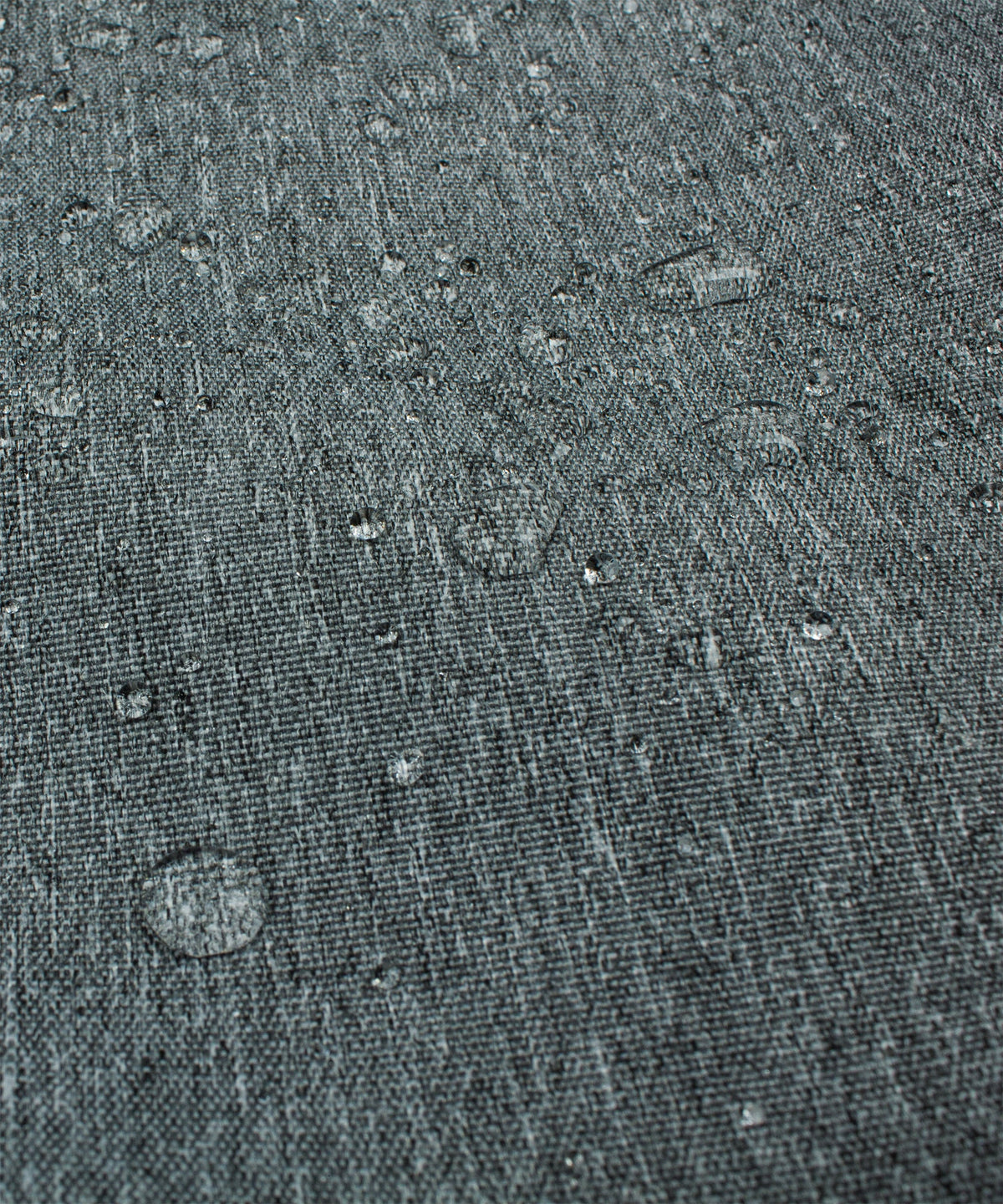 Water-resistant-looking gray cover fabric surface with speckled texture