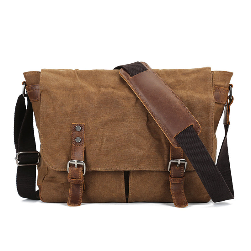 Waxed canvas crossbody messenger bag, khaki/tan with front flap and leather buckle straps.