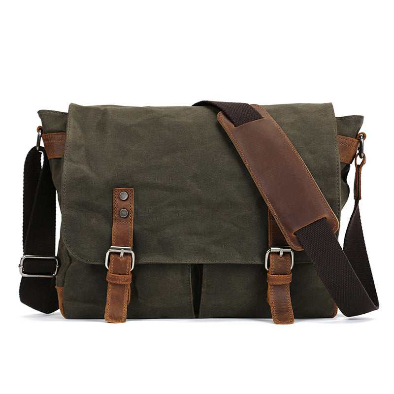 Waxed canvas crossbody bag, army green with front flap, leather buckle straps, and shoulder strap.
