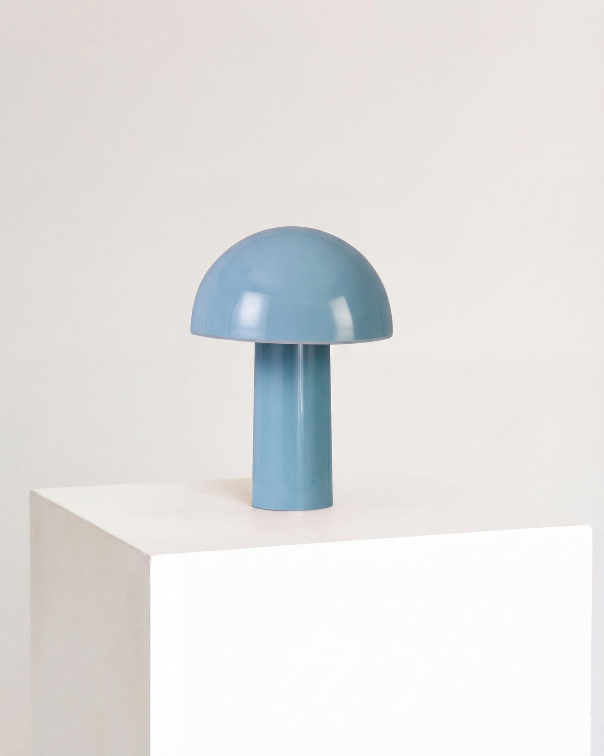 Light blue portable lamp with domed shade and short cylindrical base