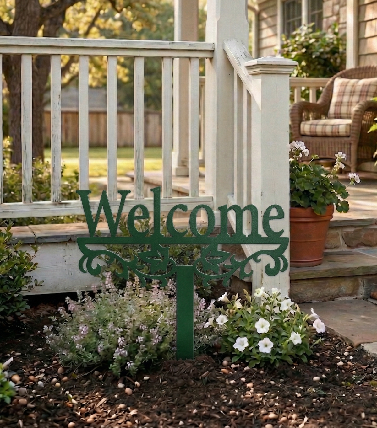 Green metal yard sign stake with “Welcome” text and decorative scroll cutout