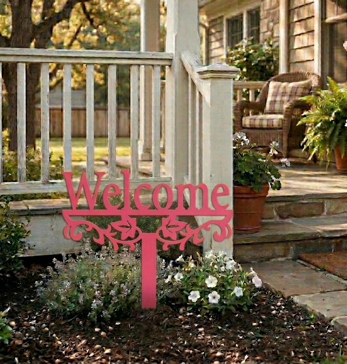Pink/red metal yard sign stake with “Welcome” text and decorative scroll cutout