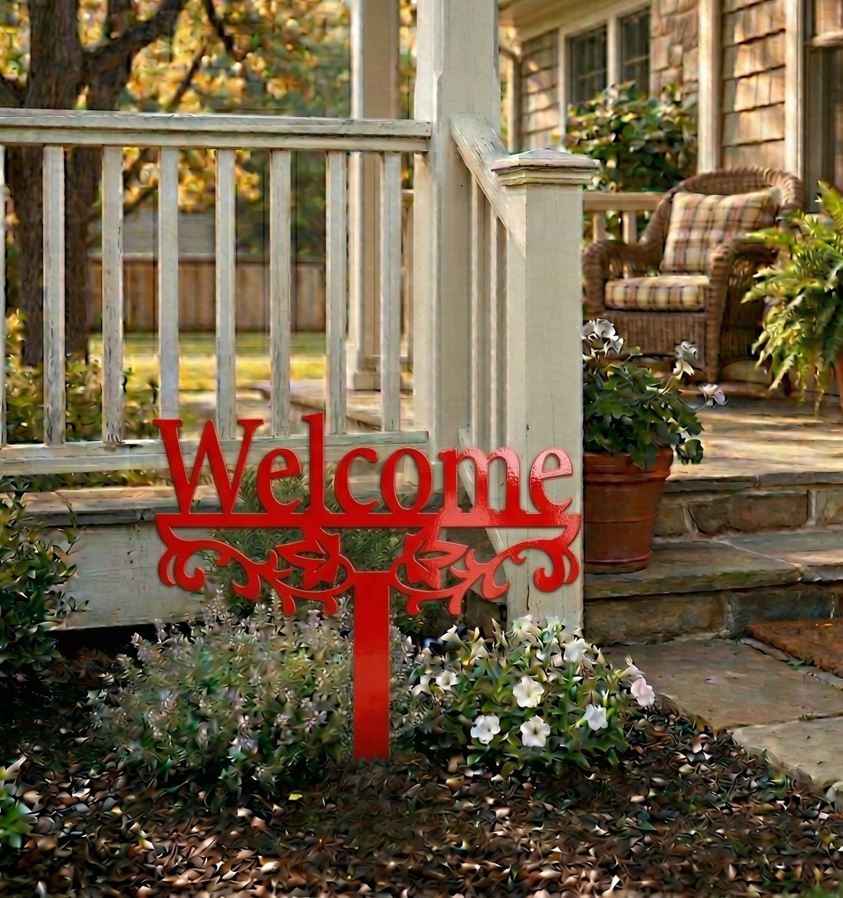 Red metal yard sign stake with “Welcome” text and decorative scroll cutout