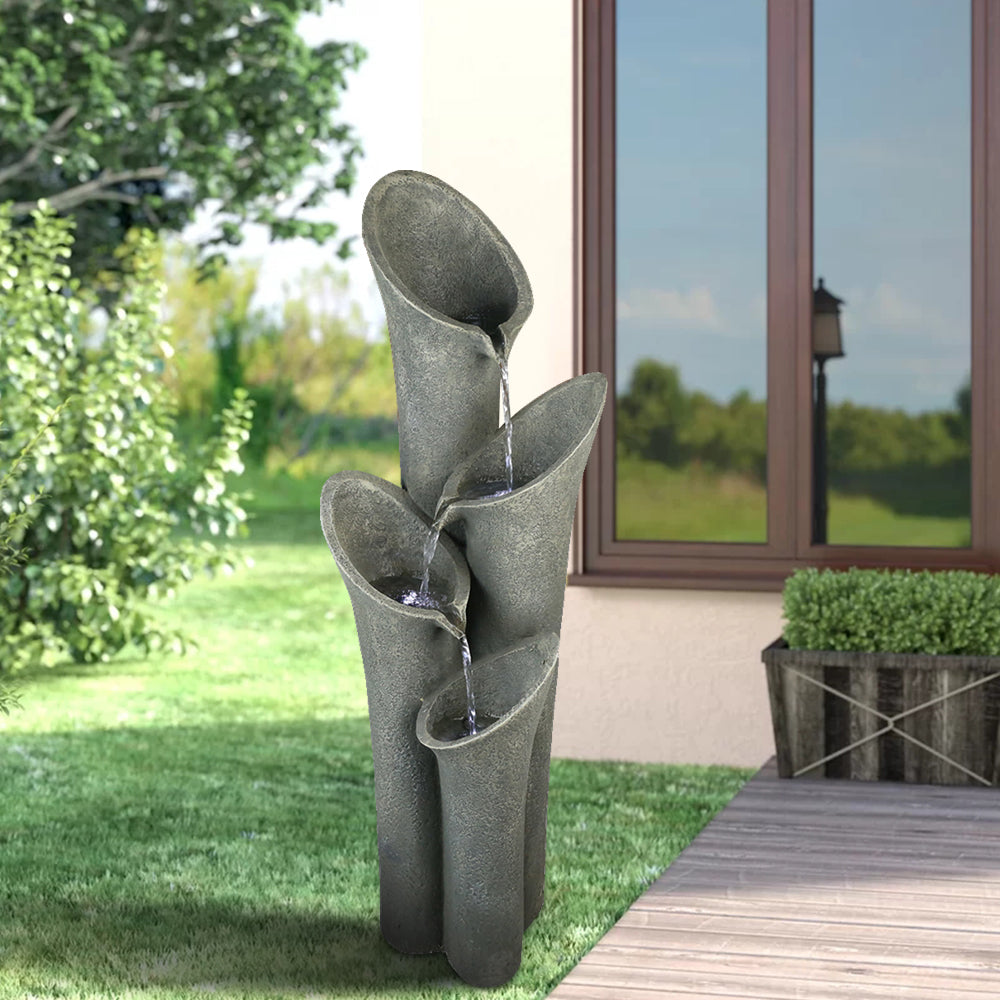 Concrete trumpet flower outdoor fountain, dark gray sculpted trumpets with flowing streams