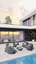Gray outdoor lounge set with armchairs, small round tables, and cushioned sofa