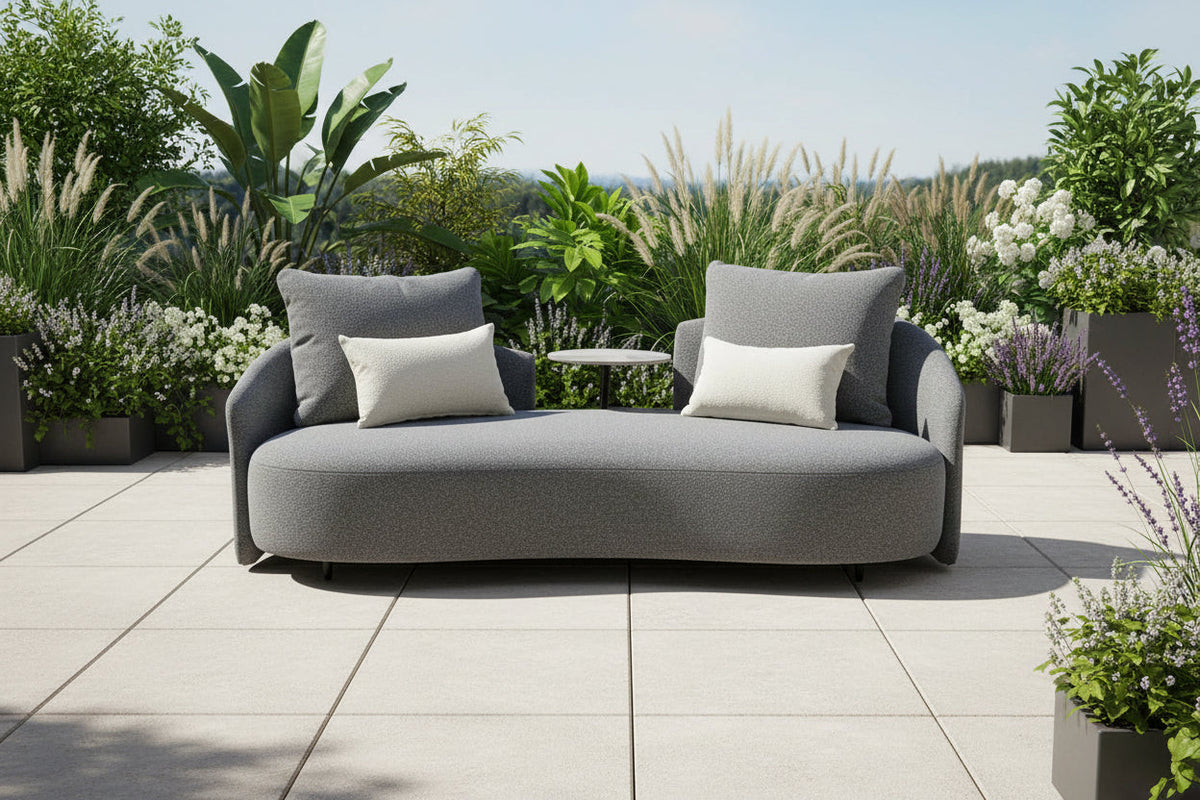 Gray outdoor loveseat sofa with two seat cushions and matching square pillows