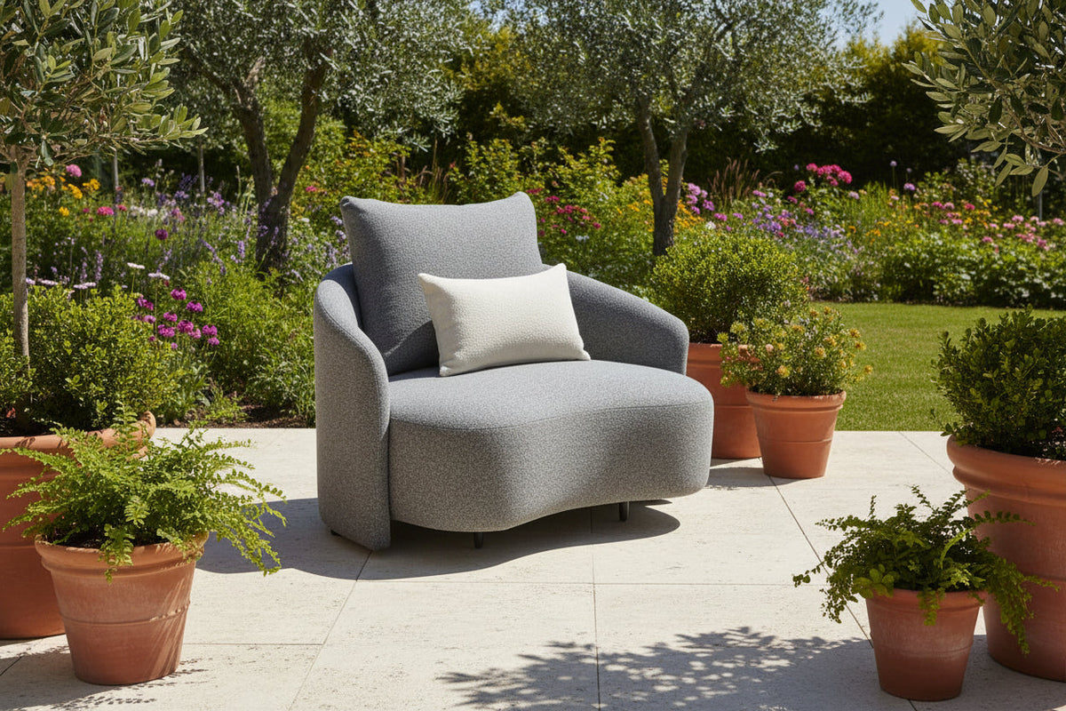 Gray outdoor armchair with two seat cushions and matching square pillows