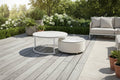 Outdoor round coffee table set with two white marble-look tops and gray metal frames