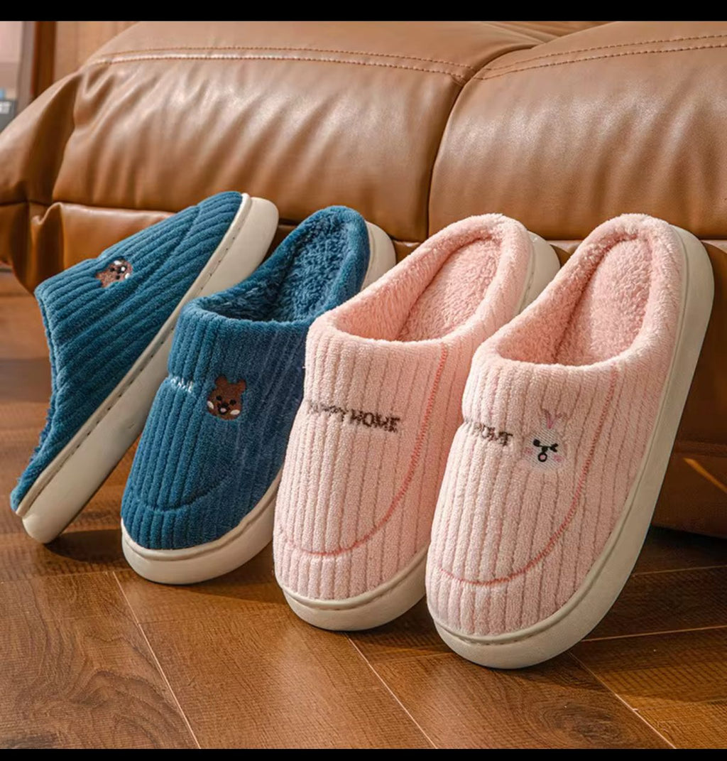 Blue and blush pink knitted critter slippers with plush lining and white rubber soles