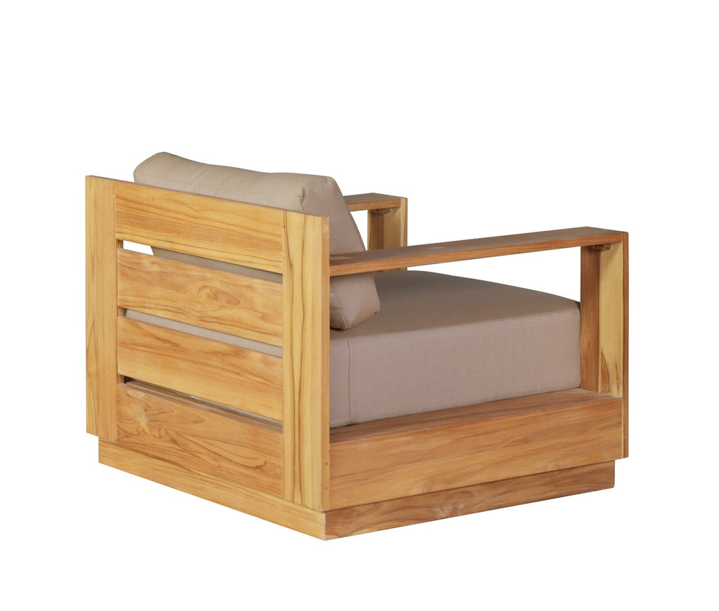Outdoor teak wood armchair with beige cushion, angled side view with back slat panel.