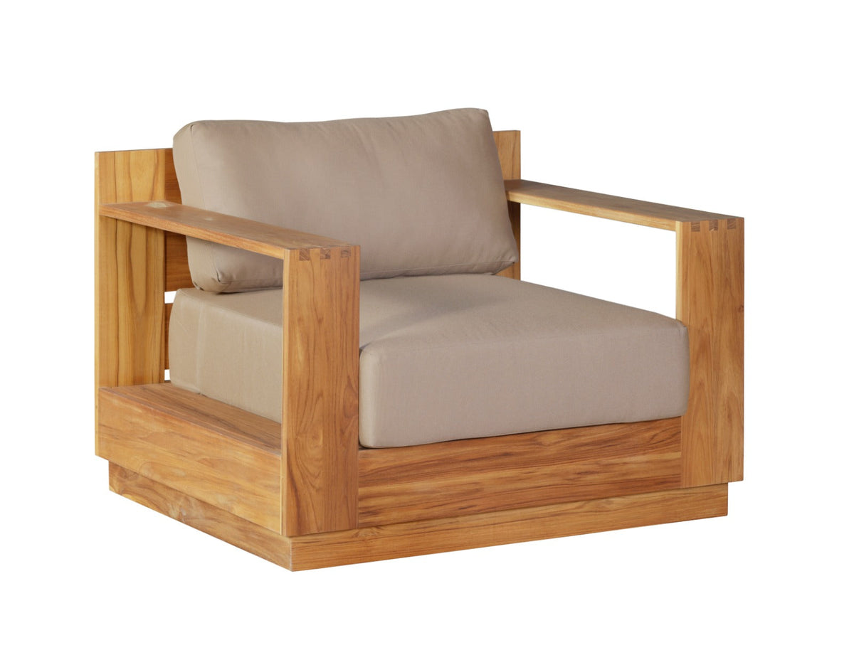 Teak outdoor armchair with beige seat and back cushions, side view with armrests and base.