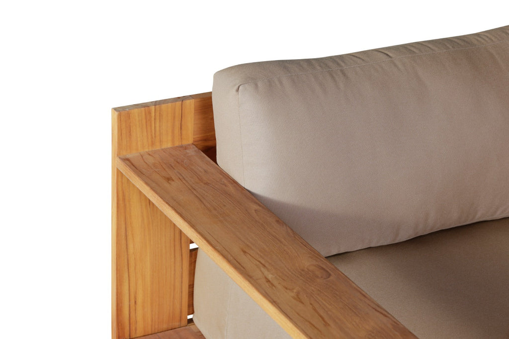 Teak outdoor chair with beige cushion and armrest bar, close-up view