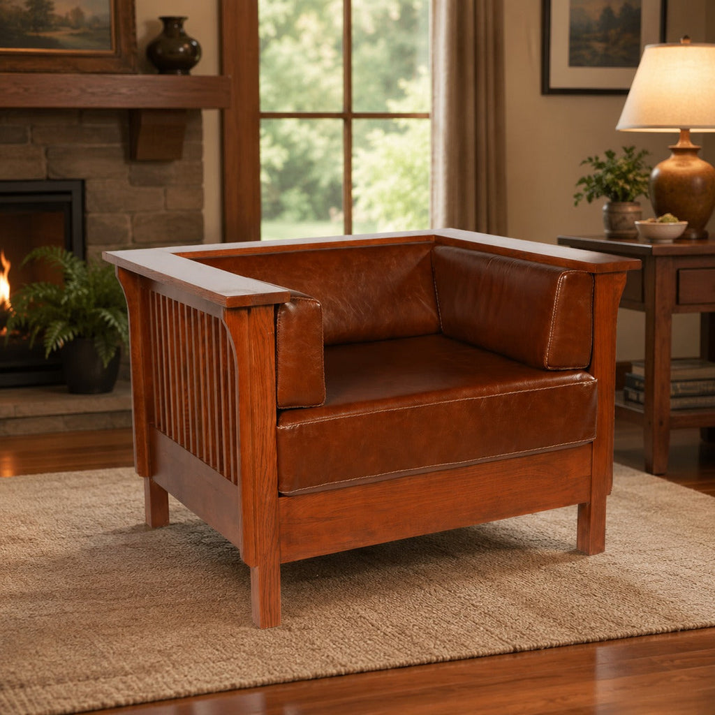 Brown leather craftsman side arm chair with slat wood sides and cushioned arms.