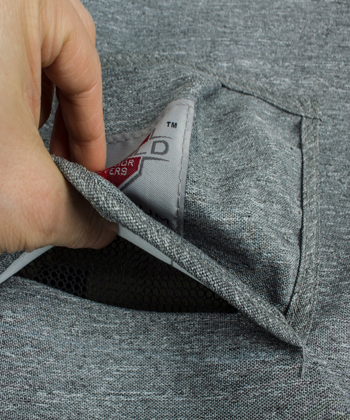Gray cover corner with label inside and elastic strap detail at seam