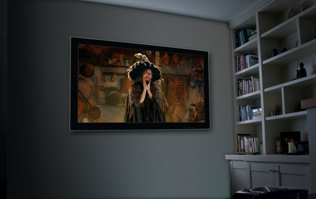 USB projector projecting a witch portrait scene onto an indoor wall