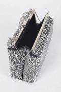Open rhinestone hotfix clutch showing black interior, metal frame and chain handles