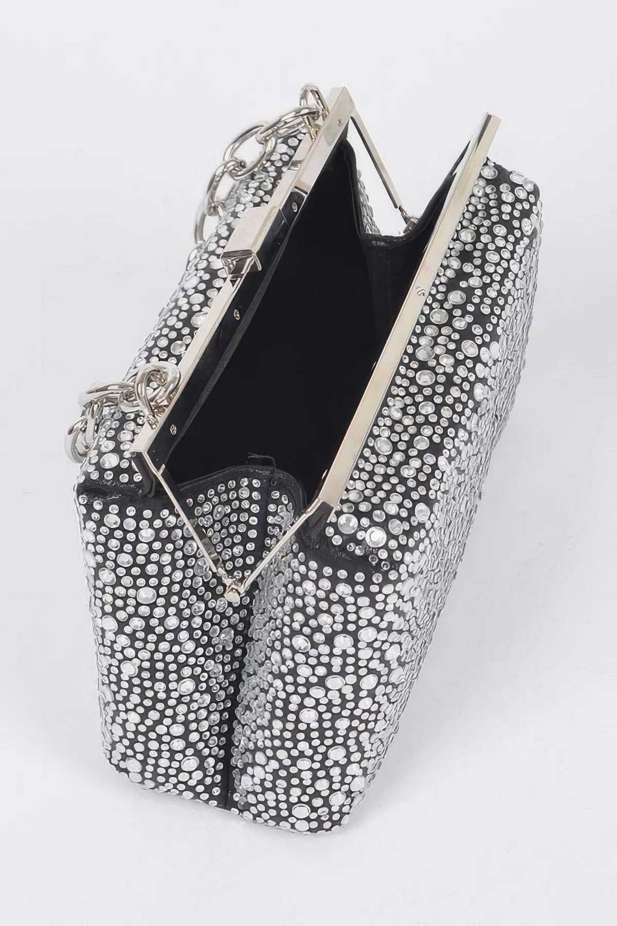 Open rhinestone hotfix clutch showing black interior, metal frame and chain handles