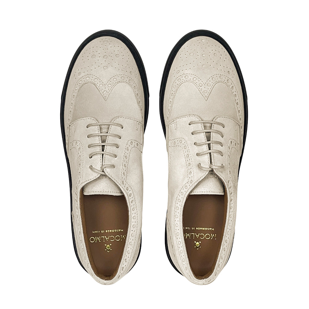 Ivory lace-up oxford shoes, front view, perforated toe and wingtip stitching