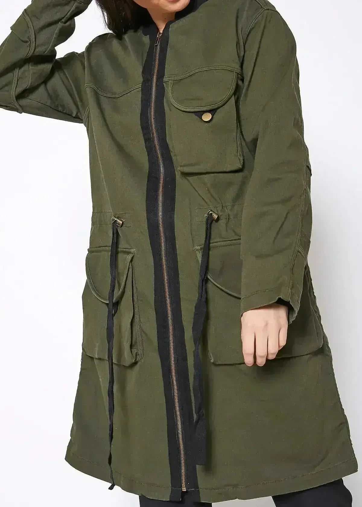 Olive utility jacket detail with multiple flap pockets and black zipper trim