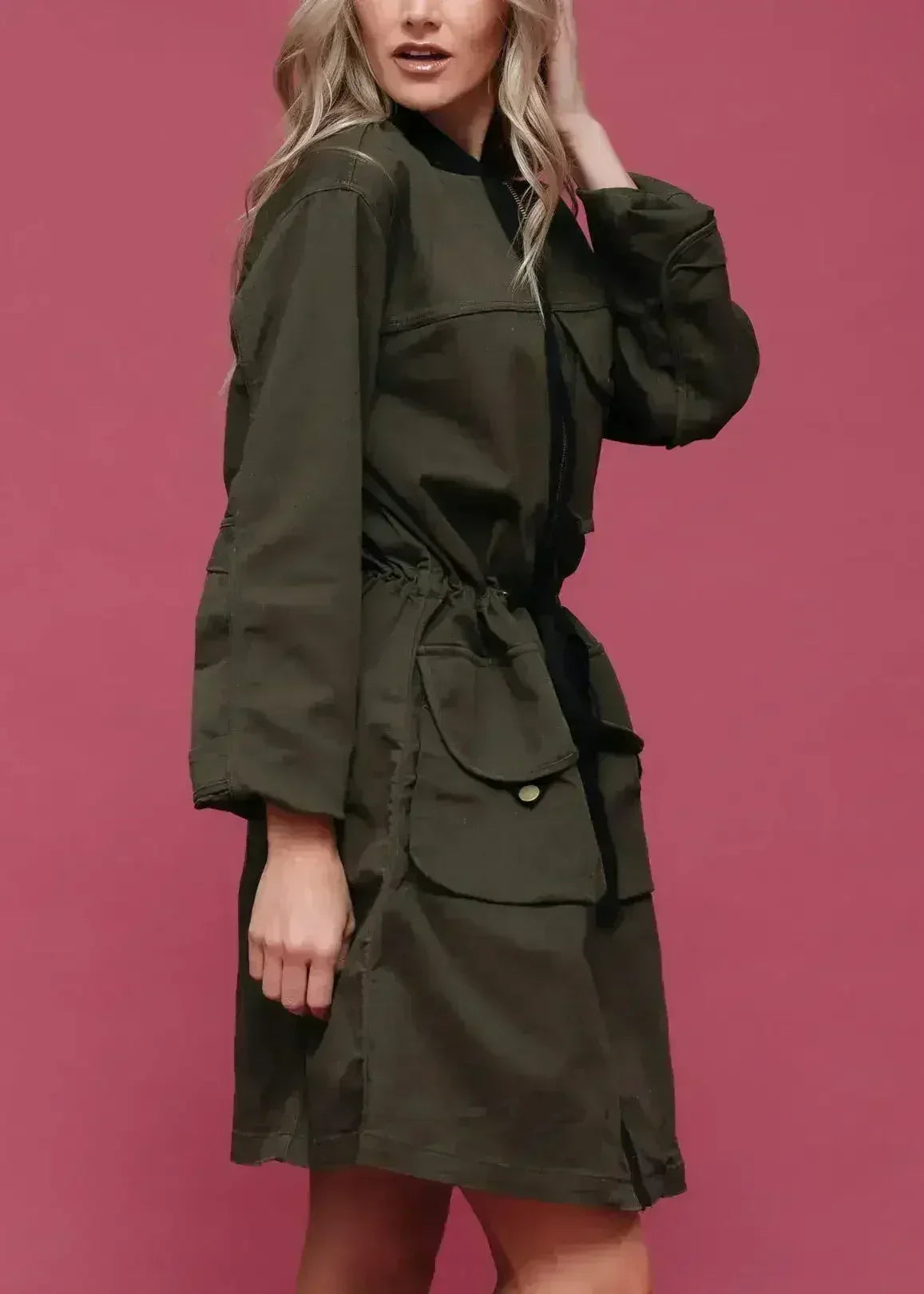 Olive long utility jacket with flap pockets and zip front, three-quarter view