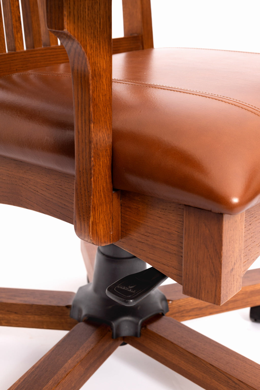 Mission oak office chair corner with caster wheels and brown leather cushion
