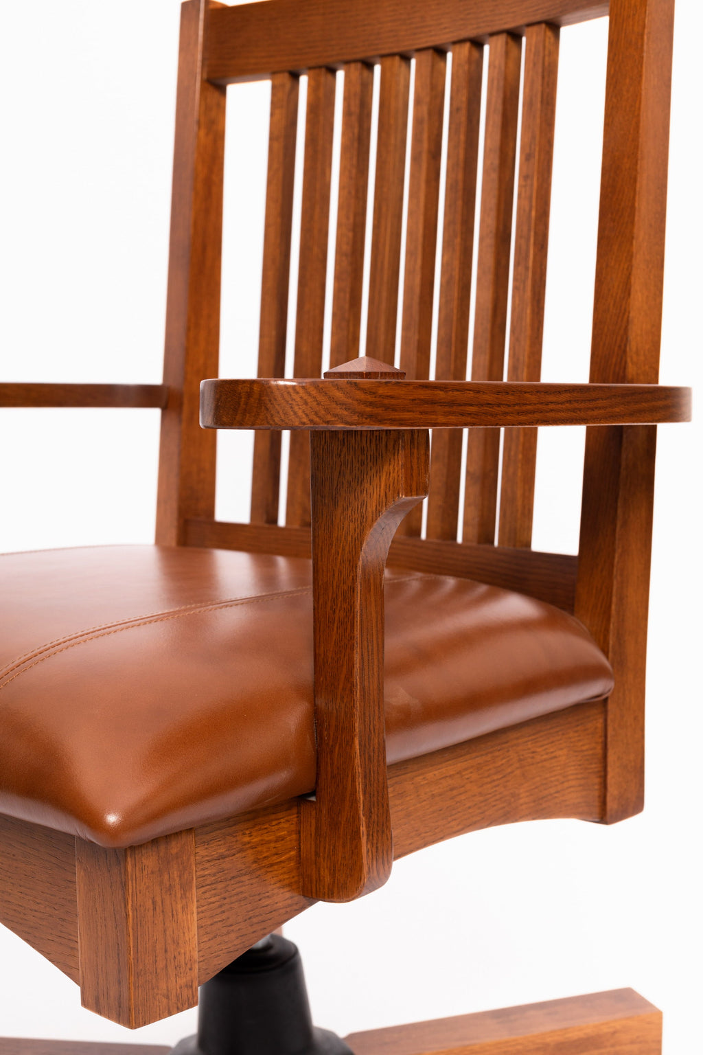 Mission oak office chair angled view, slatted back and brown leather seat