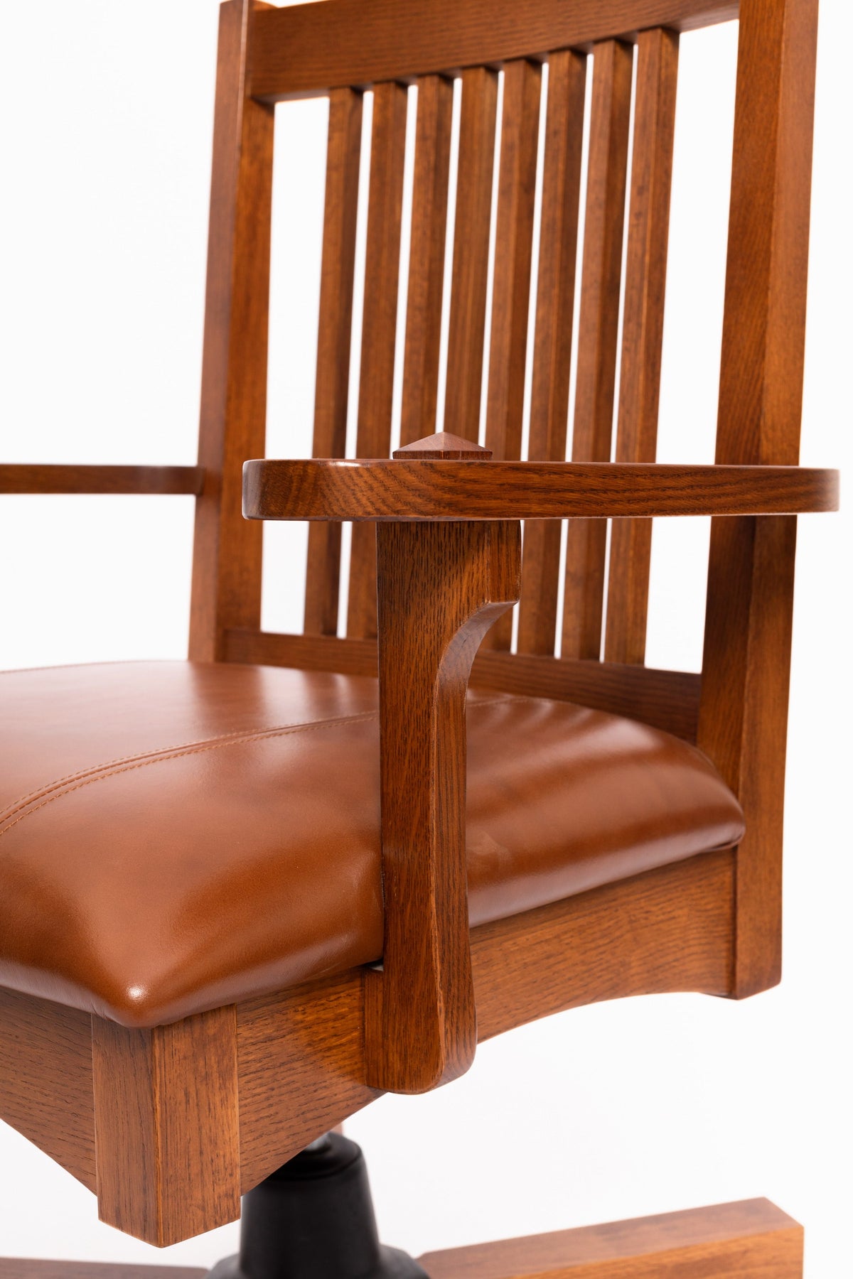 Mission oak office chair angled view, slatted back and brown leather seat