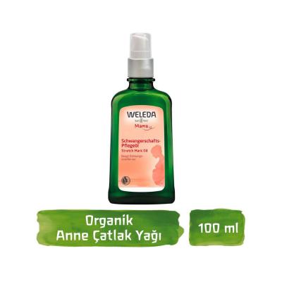 Weleda stretch mark oil bottle with pump, dark green glass, 100 ml label