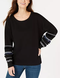 Black crew-neck sweater with striped banded cuffs and contrast fringe trim