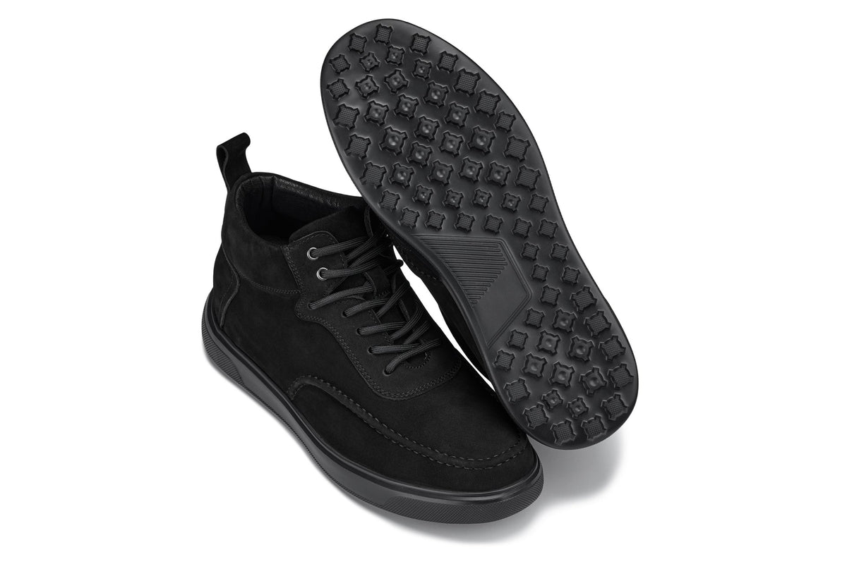 Black sneaker boots with textured grip outsole; lace-up nubuck suede upper