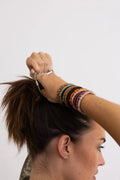 Braided hair tie bracelets, multicolor stacked on wrist