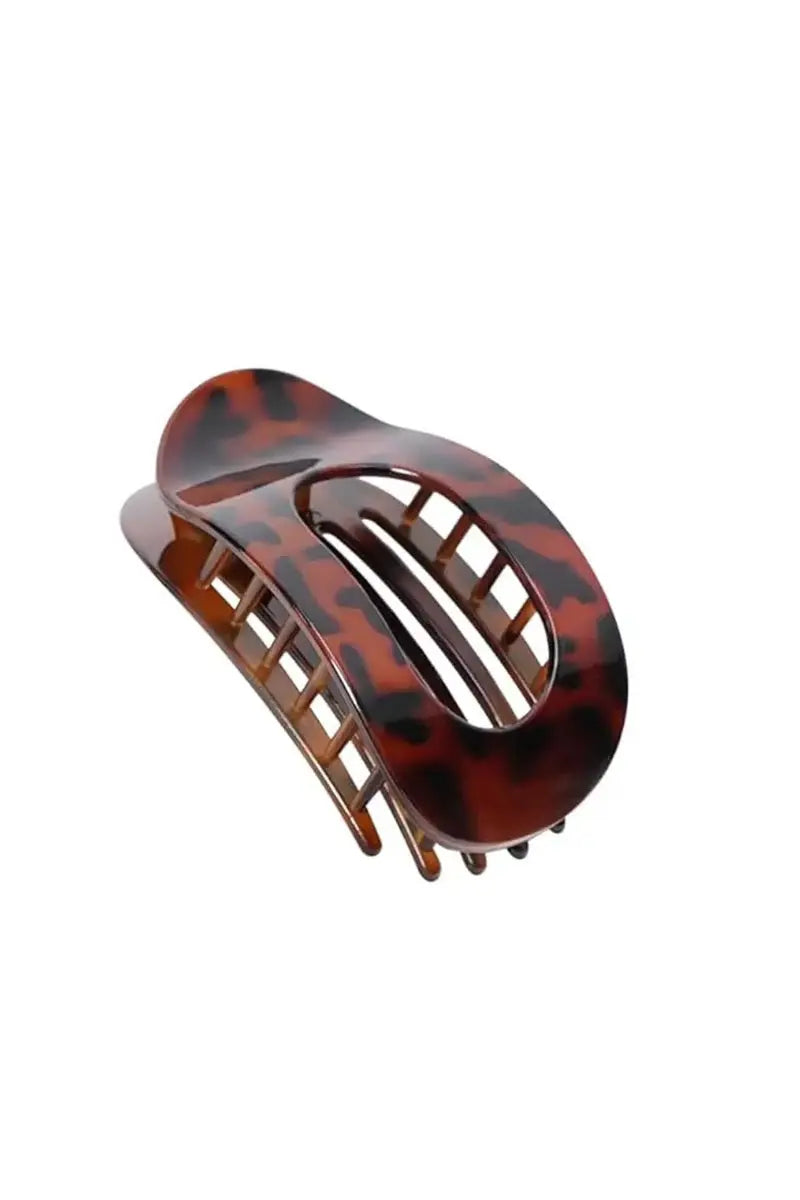 Amber tortoiseshell arc hair clip with three-bar cutout detail