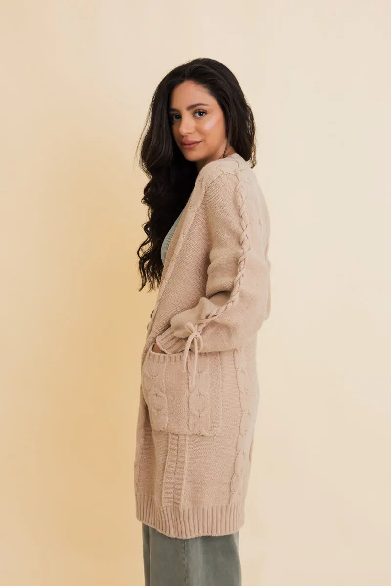 Khaki cable-knit cardigan with long sleeves and tie-drawstring details, side pockets