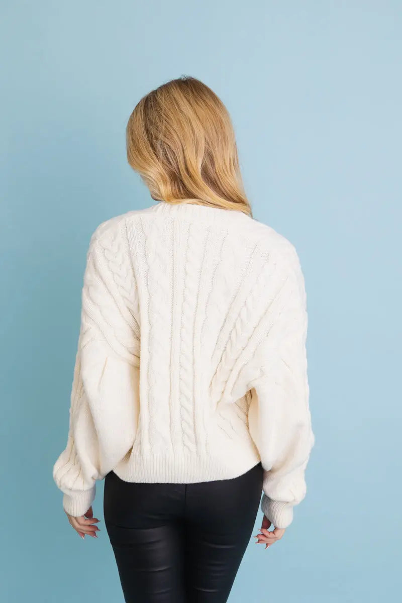 Ivory cropped cable-knit button-up cardigan, back view with cable knit detailing