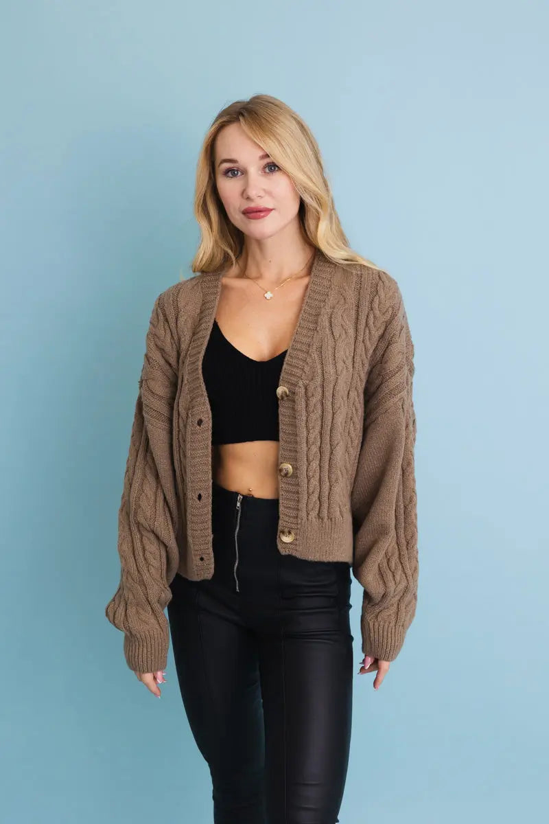 Mocha cropped cable-knit button-up cardigan with chunky cable texture and long sleeves