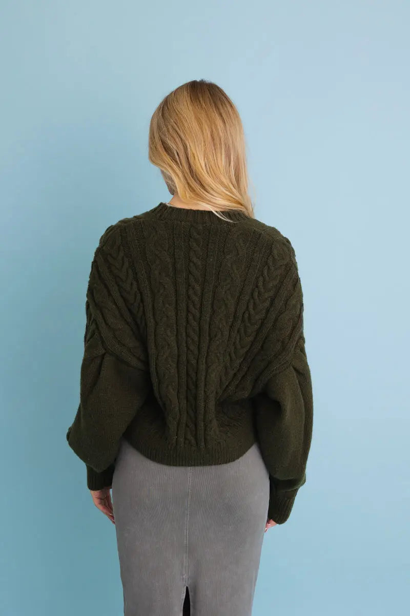 Olive chunky cable-knit cropped cardigan, back view with ribbed knit and long sleeves