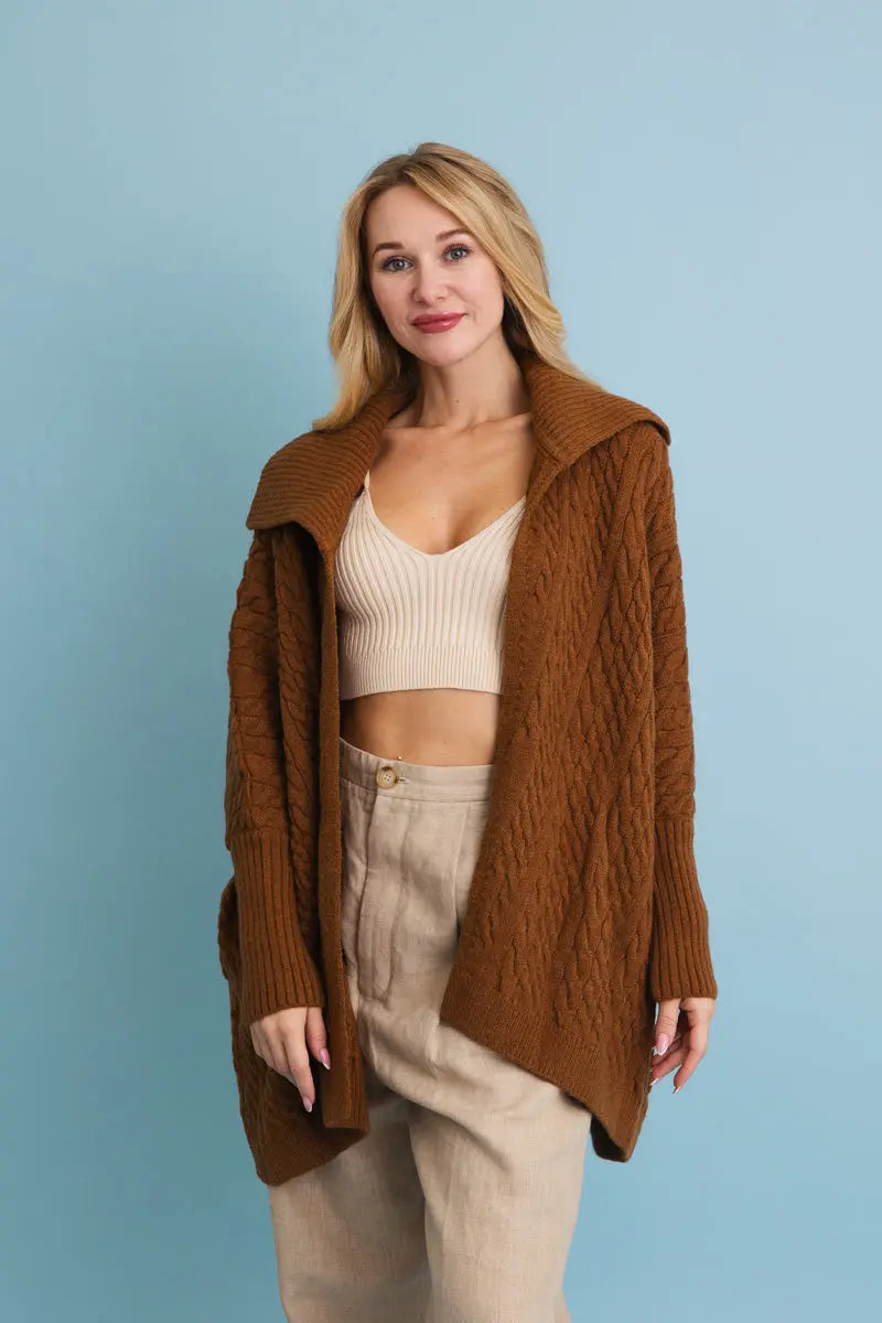 Chunky cable-knit poncho cardigan in brown, oversized shawl-collar front